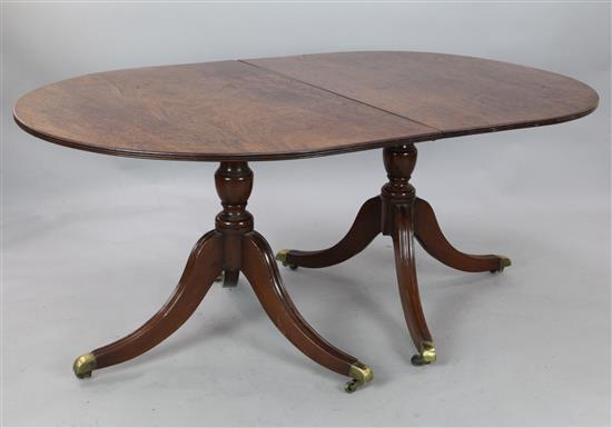 A Regency style mahogany twin pillar dining table, Extends to 9ft 6in. x 3ft 9in.